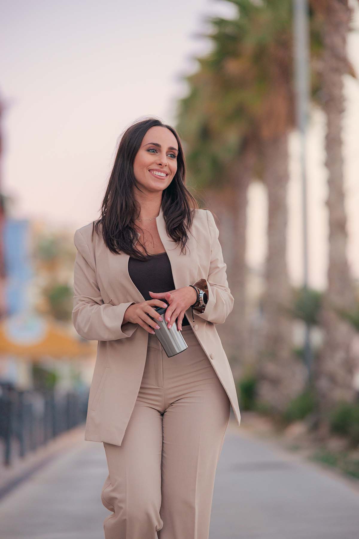 beautiful business woman walking outside Beautiful woman walking outdoors, embodying successful weight loss management.