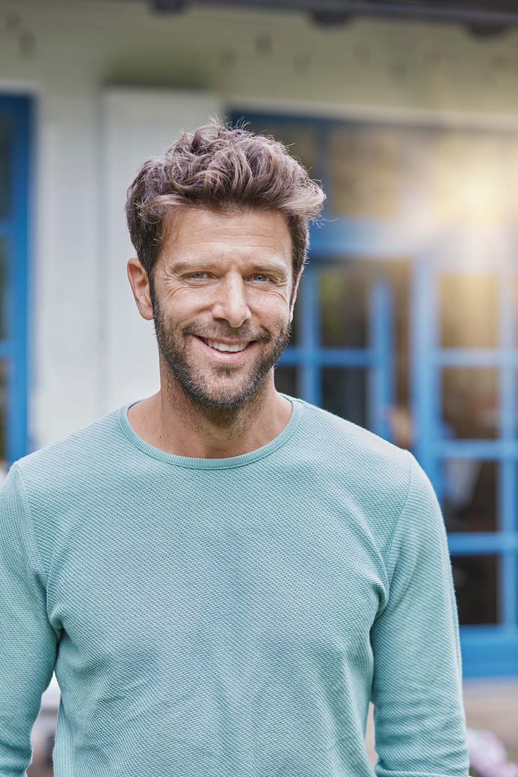 Smiling man in Los Angeles experiencing the benefits of hormone replacement therapy.