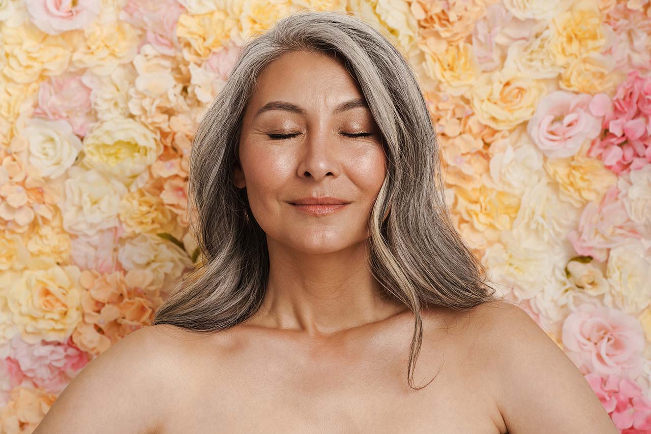 Smiling woman benefiting from hormone replacement therapy at Body Soul Nutrition Regenerative Institute.
