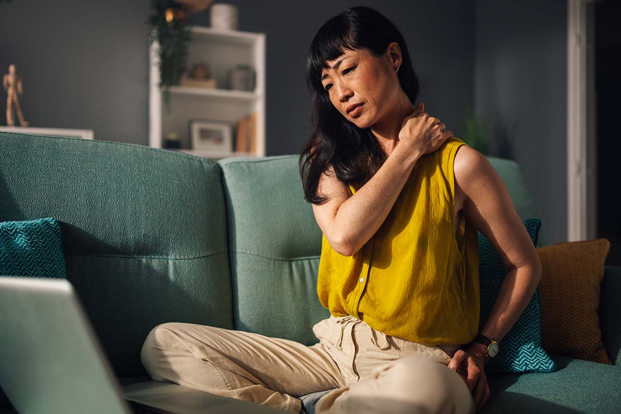 woman in chronic pain at home Woman experiencing chronic pain at home, seeking effective pain management solutions.